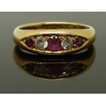 An 18ct gold ring set with rubies and diamonds, Birmingham 1915, size M/N, 6.00g
