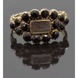 Georgian / Victorian mourning ring set with plaited hair in a glass compartment surrounded by French