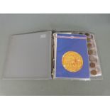 An amateur collection of world coins in an album, all small coinage