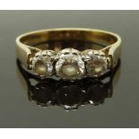 A 9ct gold ring set with three cubic zirconia, size O, 2.28g