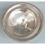 White metal pedestal tazza with pierced and embossed decoration, marked Empire Sterling weighted,