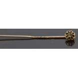 Victorian yellow metal stick pin set with a rose cut diamond