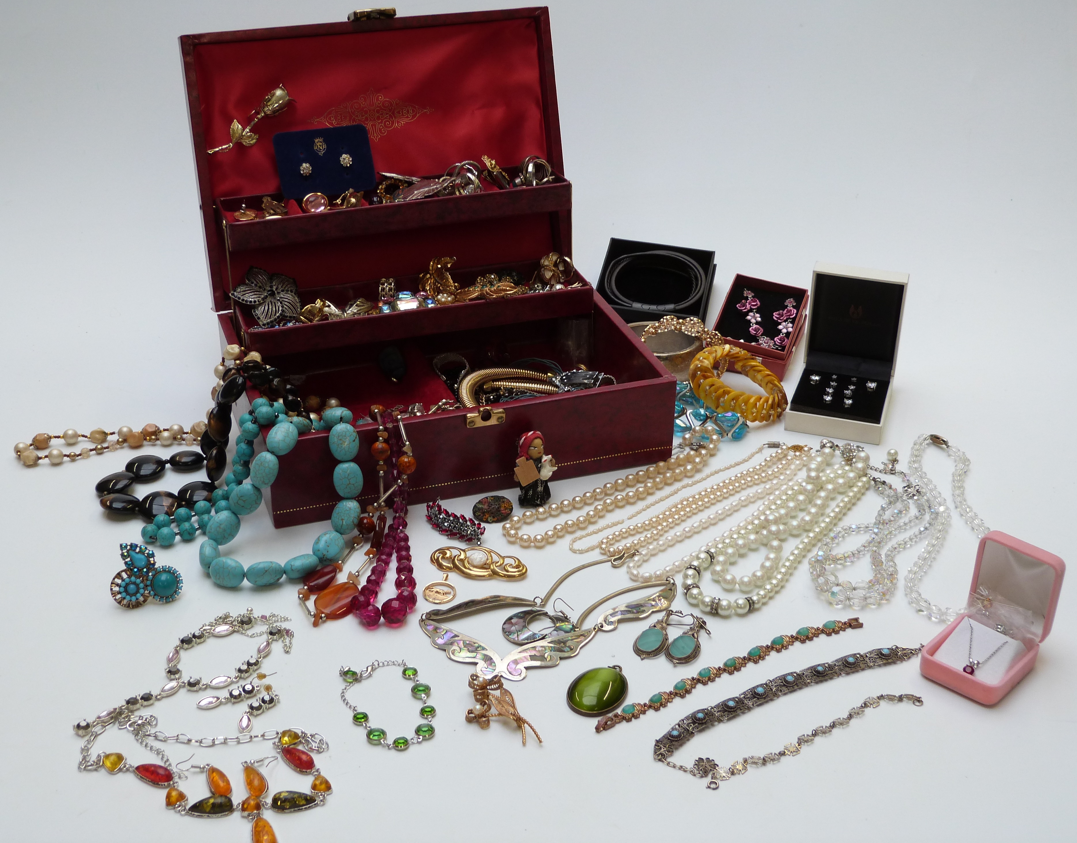 A collection of costume jewellery including rings, vintage earrings including Swarovski and Trifari,