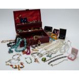 A collection of costume jewellery including rings, vintage earrings including Swarovski and Trifari,