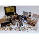 A collection of costume jewellery including beads, brooches, watches including Timex, Citizen, etc