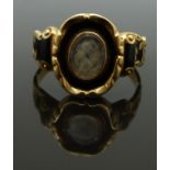 Victorian 18ct gold ring set with plaited hair to the central glass compartment surrounded by