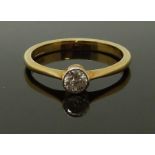 An 18ct gold ring set with a diamond of approximately 0.25ct, size M, 2.29g