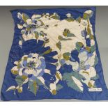 Christian Dior silk scarf decorated with flowers on a blue and ivory ground, 75 x 75cm