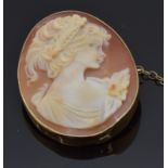 A 9ct gold brooch set with a cameo of a young woman, 3.7 x 2.7cm