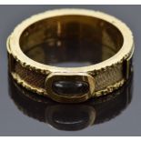 Victorian mourning ring set with plaited hair in a glass compartment, around the band rectangular