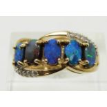 A 9ct gold ring set with five boulder opals and zircons, 4.7g, size N