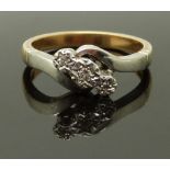 A 9ct gold ring set with three diamonds in a platinum setting, size K/L, 3.8g