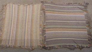 Two 19th/20thC shawls of similar multicoloured design with long fringes, 190 x 190cm including