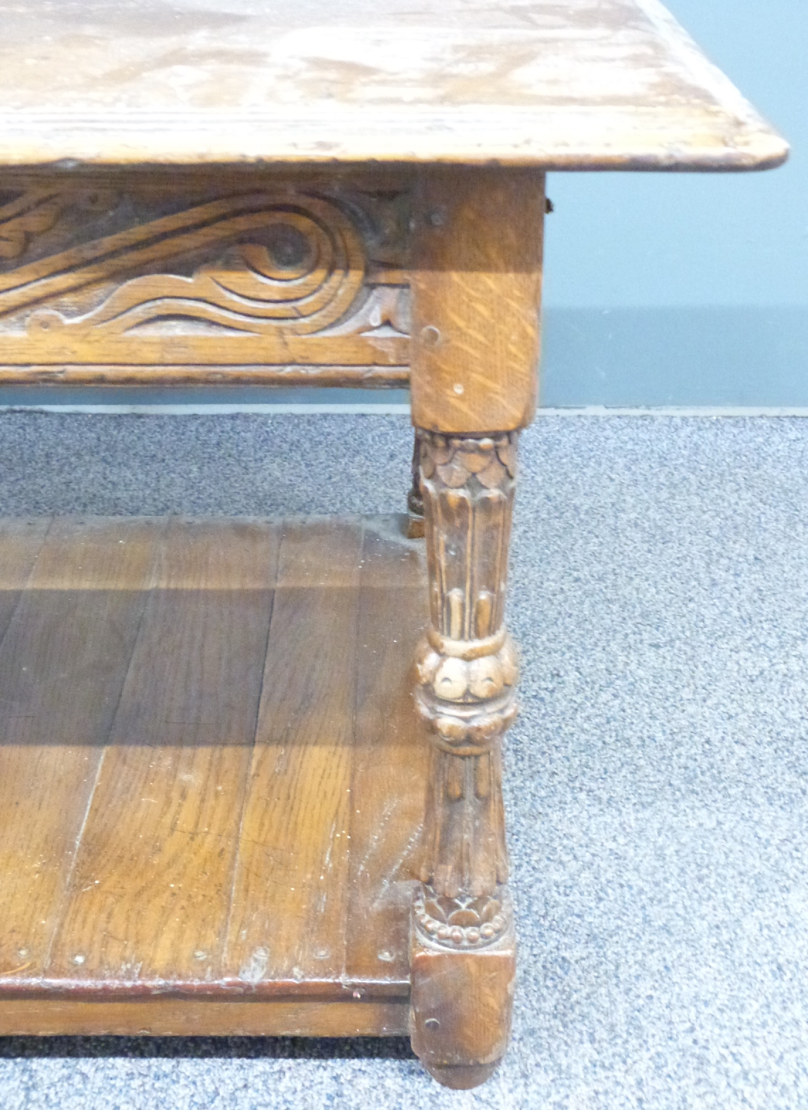 An oak coffee table with carved decoration to the sides and legs, W122 x D54 x H46cm - Image 3 of 3