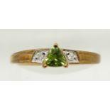 A 9ct gold ring set with a trilliant cut tourmaline and diamonds, 1.7g, size N