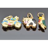 Three 9ct gold and enamel charms, one in the form of a cow, one a parrot and the other a