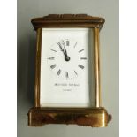 Matthew Norman of London 20thC brass carriage clock in corniche style case, the enamel white Roman