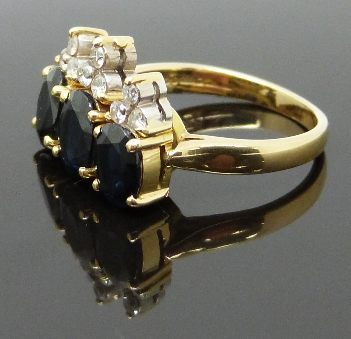 An 18ct gold ring set with three oval cut sapphires and diamonds, 6.6g, size K - Image 2 of 2