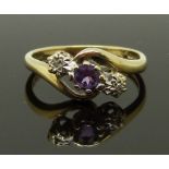 A 9ct gold ring set with an amethyst and diamonds, size H, 1.99g