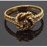 A 9ct gold knot ring in a Bakelite Bravingtons box, size J, 1.45g