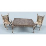 Victorian novelty hallmarked silver doll's house table and two chairs, the table having embossed