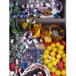 A large collection of beaded necklaces including nephrite jade, pearl, pressed amber, quartz, glass,