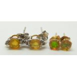 Two pairs of 9ct gold earrings each set with opals