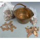 A large quantity of UK sundry coinage and pennies contained in two brass cooking pans