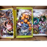 A collection of costume jewellery including beaded necklaces, bangles, brooches, etc
