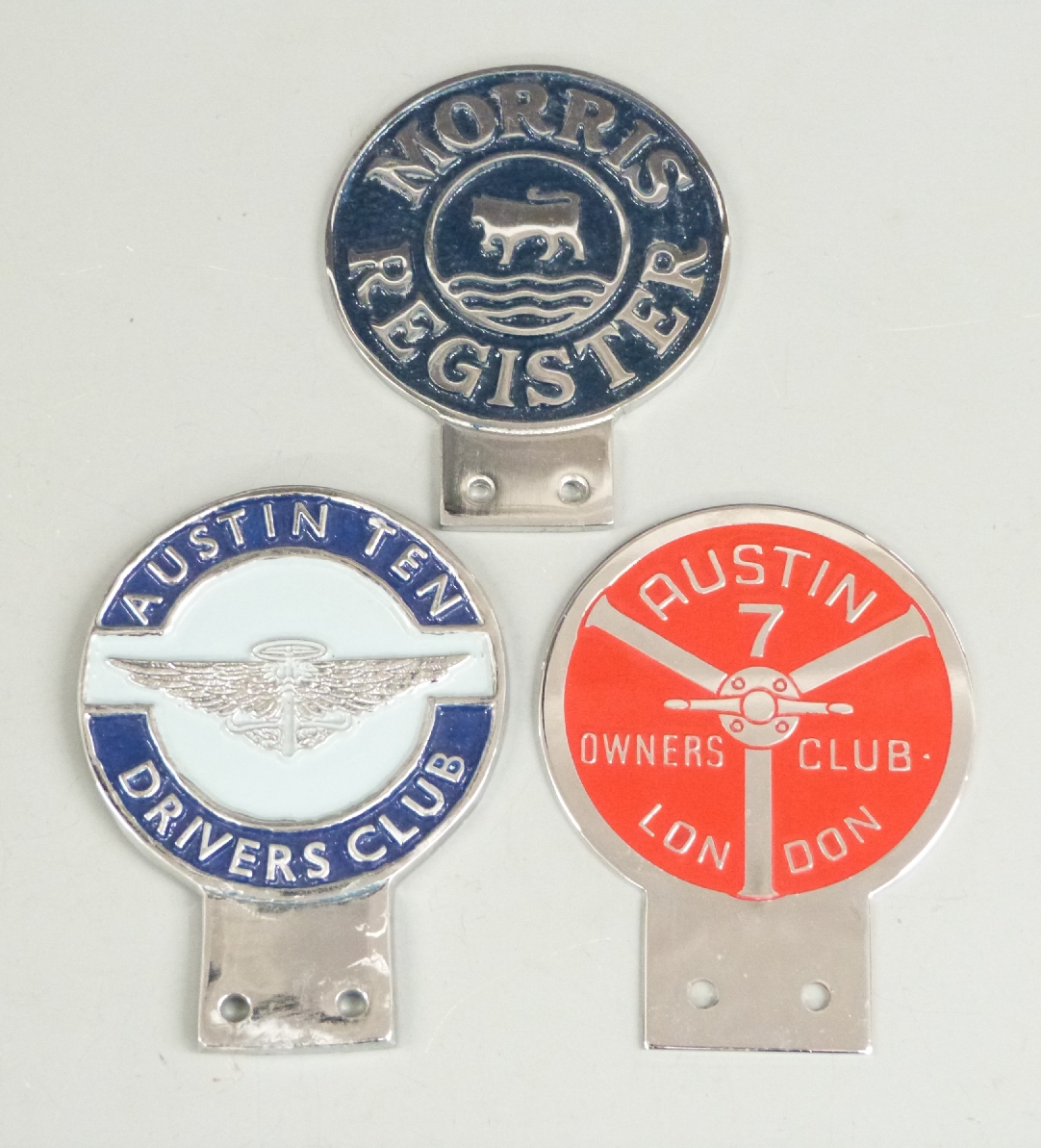 Three car badges comprising Austin Ten Drivers Club, Morris Register and Austin 7 Owners Club