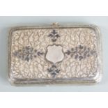 Russian white metal cigarette case, with embossed decoration and niello highlights, width 9.5 cm