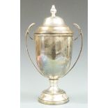 Large hallmarked silver twin handled lidded trophy cup, Birmingham 1966 maker's mark rubbed,