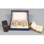 Cased pair of Victorian hallmarked silver napkin rings, Birmingham 1899 maker Henry Williamson