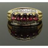 A 9ct gold ring set with garnets and diamonds, size L, 2.26g