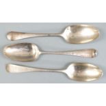 Three Georgian bottom hallmarked table spoons, marks indistinct, one appears to be London 1758,