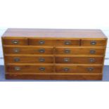 Large campaign style chest of three over six drawers with brass handles, W147 x D43 x H71cm