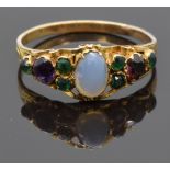 Victorian yellow metal ring set with a moonstone, emeralds and amethyst, size L