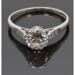 Art Deco platinum ring set with a round cut diamond of approximately 1.22ct with diamond encrusted