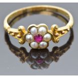 Victorian 18ct gold ring set with a ruby surrounded by split pearls, size R