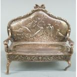 Novelty Edward VII hallmarked silver doll's house sofa having embossed decoration of birds to the