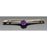 A 9ct gold brooch set with a round cut amethyst