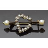 Victorian brooch in the form of a heart set with alternating diamonds and pearls with two further
