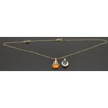 A 9ct gold pendant set with pressed amber and another 9ct gold pendant set with a sapphire, 4g