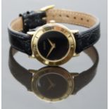 Gucci ladies wristwatch ref. 3000 with gold hands, black dial, inlaid black Roman numerals to the