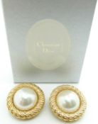 A pair of Christian Dior earrings in original box
