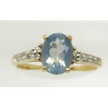 A 9ct gold ring set with an oval blue fire opal and diamonds, 1.8g, size N