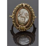 Georgian mourning ring set with an ivory plaque depicting a gravestone and two doves, surrounded
