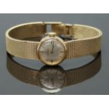 Omega 9ct gold ladies wristwatch ref.711.5603 with black hands, gold baton markers, silver dial