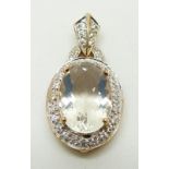 A 9ct gold pendant set with an oval cut ice opal surrounded by zircon, 3.2g