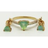 A 9ct gold ring set with a trilliant cut Paraiba opal and diamonds, with a pair of similar earrings,